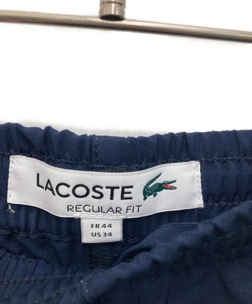 LACOSTE（ラコステ）LACOSTE (ラコステ) ウールフランネルチノパンツ ネイビー サイズ:34の古着・服飾アイテム