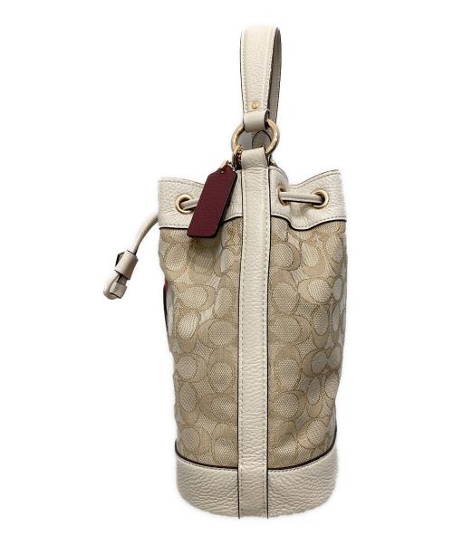 COACH（コーチ）COACH (コーチ) Dempsey Drawstring Bucket Bag ベージュの古着・服飾アイテム