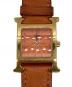 HERMESエルメス）の古着「Hウォッチ」｜オレンジ