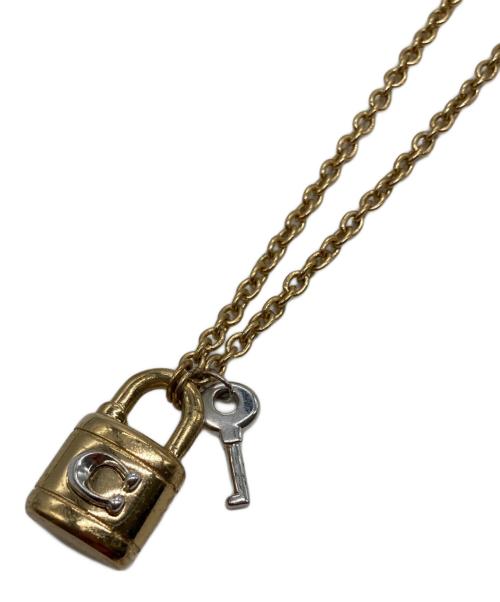COACH（コーチ）COACH (コーチ) 南京錠モチーフネックレス ゴールドの古着・服飾アイテム