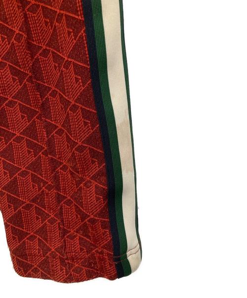 LACOSTE（ラコステ）LACOSTE (ラコステ) サイドテーピングモノグラムトラックパンツ レッド サイズ:XSの古着・服飾アイテム