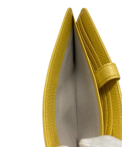 ATELIER NUU（アトリエヌウ）ATELIER NUU (アトリエヌウ) レザーウォレット イエローの古着・服飾アイテム