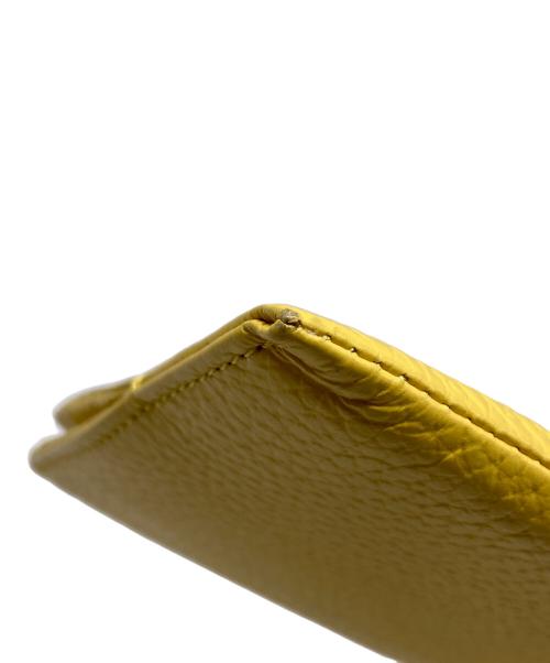 ATELIER NUU（アトリエヌウ）ATELIER NUU (アトリエヌウ) レザーウォレット イエローの古着・服飾アイテム