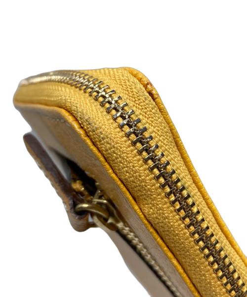 DAKOTA（ダコタ）DAKOTA (ダコタ) L字ジップ長財布 イエローの古着・服飾アイテム