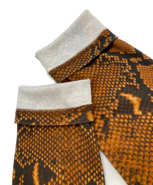 JOHN LAWRENCE SULLIVAN（ジョン ローレンス サリバン）JOHN LAWRENCE SULLIVAN (ジョン ローレンス サリバン) 総柄ハイネックカットソー ブラウン サイズ:Ｍの古着・服飾アイテム