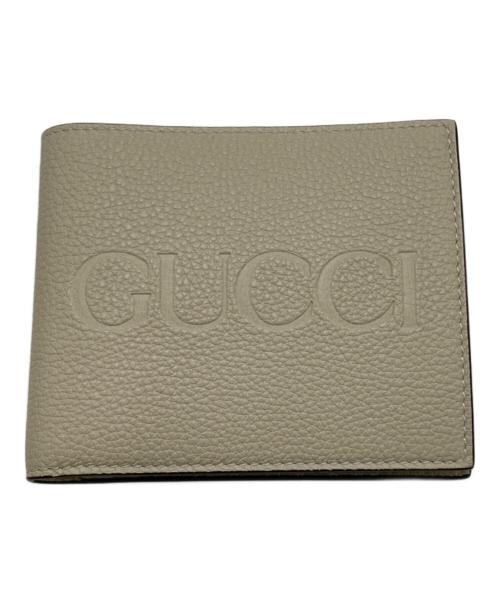 GUCCI（グッチ）GUCCI (グッチ) エンボスロゴ2つ折り財布 ベージュの古着・服飾アイテム