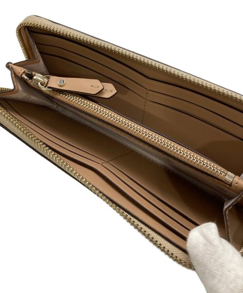 Kate Spade（ケイトスペード）Kate Spade (ケイトスペード) バージェス コートラウンドファスナーウォレット ゴールドの古着・服飾アイテム