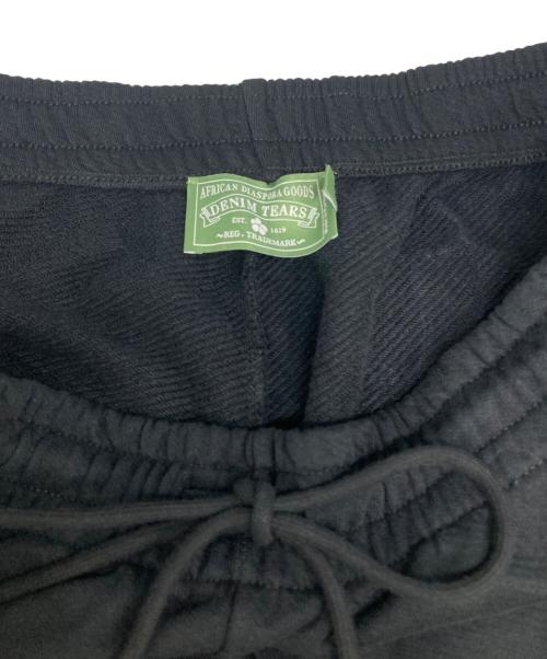 Denim Tears（デニムティアーズ）Denim Tears (デニムティアーズ) Cotton Wreath Baggy Sweatpants ブラック サイズ:XXLの古着・服飾アイテム