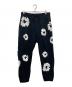 Denim Tears（デニムティアーズ）の古着「Cotton Wreath Baggy Sweatpants」｜ブラック