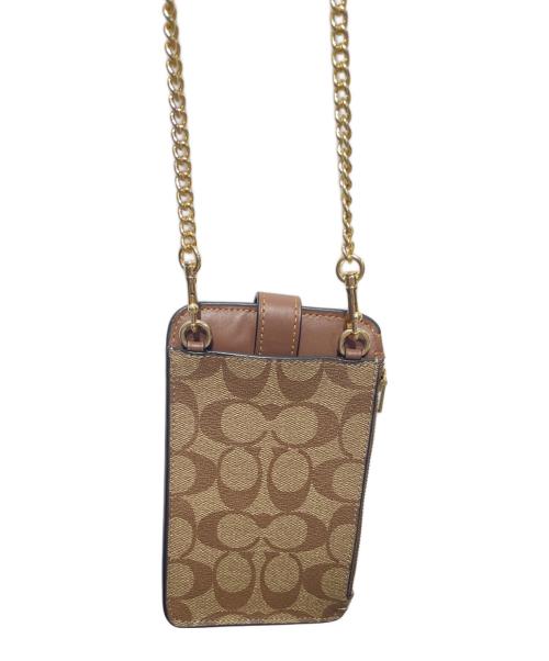 COACH（コーチ）COACH (コーチ) ノース／サウス フォーン クロスボディ シグネチャー キャンバス ブラウンの古着・服飾アイテム