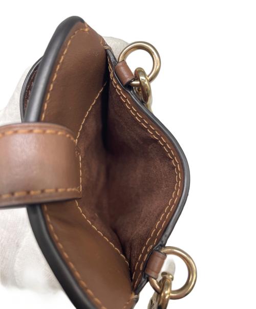 COACH（コーチ）COACH (コーチ) ノース／サウス フォーン クロスボディ シグネチャー キャンバス ブラウンの古着・服飾アイテム