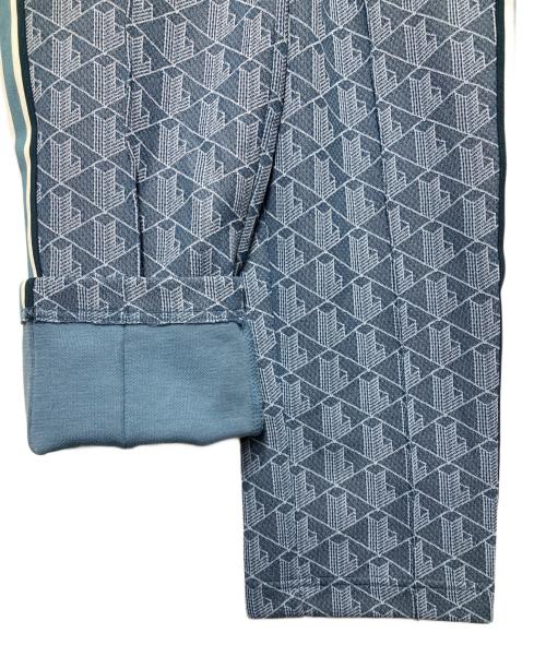 LACOSTE（ラコステ）LACOSTE (ラコステ) サイドテーピングモノグラムジャカードトラックパンツ ブルー サイズ:3 未使用品の古着・服飾アイテム