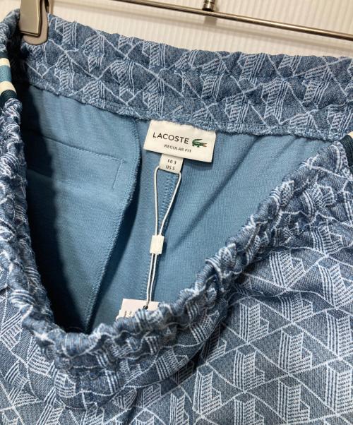 LACOSTE（ラコステ）LACOSTE (ラコステ) サイドテーピングモノグラムジャカードトラックパンツ ブルー サイズ:3 未使用品の古着・服飾アイテム