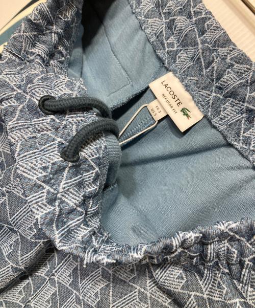 LACOSTE（ラコステ）LACOSTE (ラコステ) サイドテーピングモノグラムジャカードトラックパンツ ブルー サイズ:3 未使用品の古着・服飾アイテム