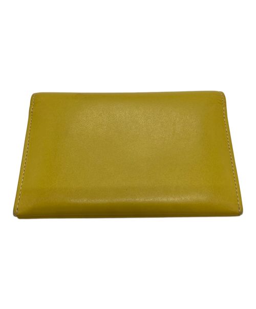 VASIC（ヴァジック）VASIC (ヴァジック) 2つ折り財布 イエローの古着・服飾アイテム