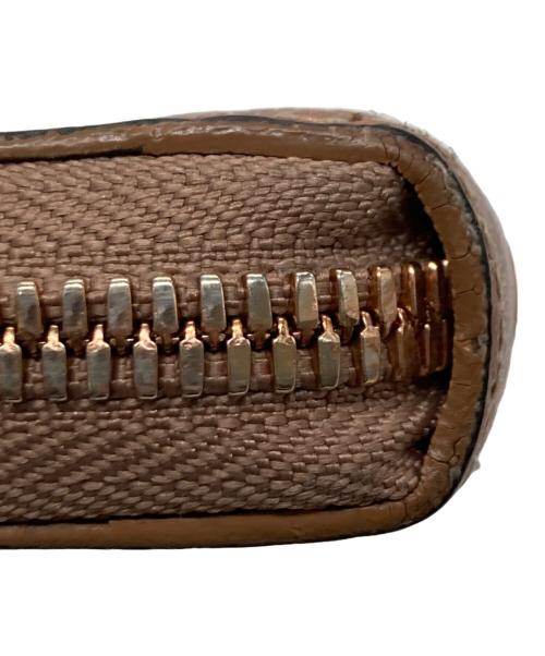 MCM（エムシーエム）MCM (エムシーエム) ラウンドファスナー長財布 ゴールドの古着・服飾アイテム