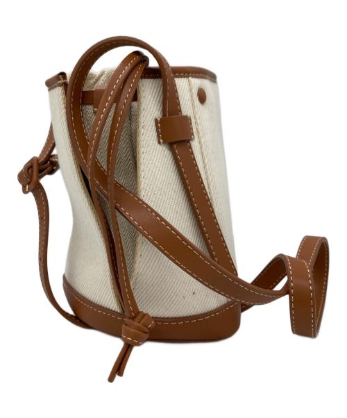 TOMORROW LAND（トゥモローランド）TOMORROW LAND (トゥモローランド) the dilettante (ザ・ディレッタント) 巾着ショルダーバッグ アイボリー×ブラウンの古着・服飾アイテム