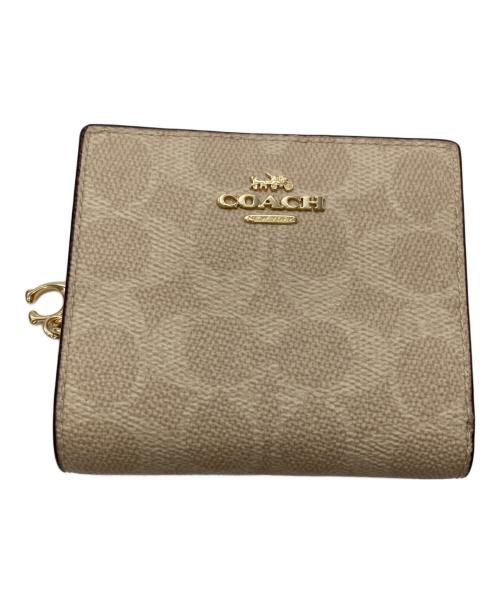 COACH（コーチ）COACH (コーチ) スナップ ウォレット・シグネチャー キャンバス ベージュの古着・服飾アイテム