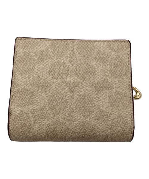 COACH（コーチ）COACH (コーチ) スナップ ウォレット・シグネチャー キャンバス ベージュの古着・服飾アイテム