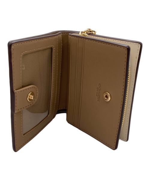 COACH（コーチ）COACH (コーチ) スナップ ウォレット・シグネチャー キャンバス ベージュの古着・服飾アイテム