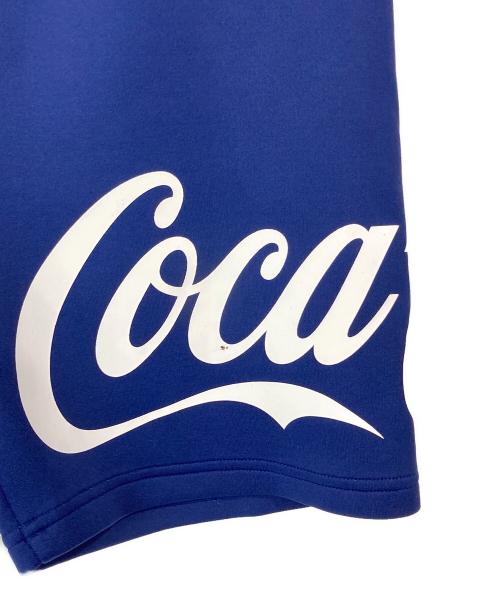F.C.R.B.（エフシーレアルブリストル）F.C.R.B. (エフシーレアルブリストル) Coca Cola (コカコーラ) ハーフパンツ ネイビー サイズ:Mの古着・服飾アイテム