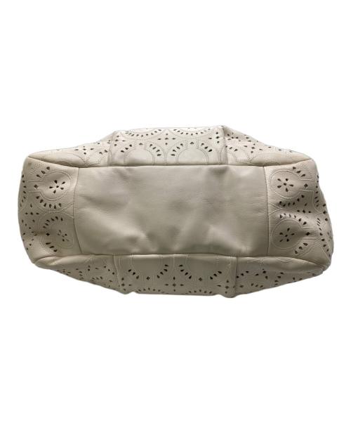 COACH（コーチ）COACH (コーチ) マギー パンチングレザー トートバッグ アイボリーの古着・服飾アイテム