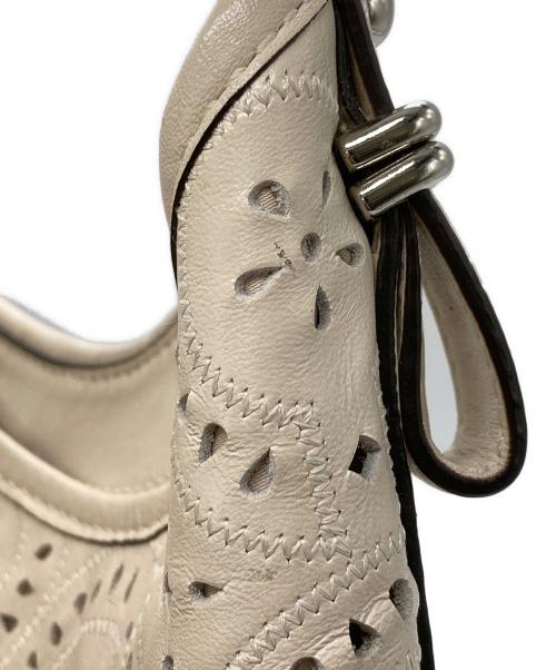 COACH（コーチ）COACH (コーチ) マギー パンチングレザー トートバッグ アイボリーの古着・服飾アイテム