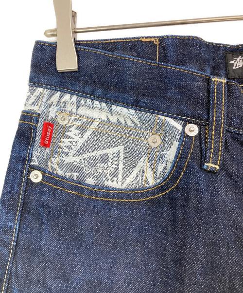 stussy（ステューシー）stussy (ステューシー) プリントデニムパンツ インディゴ サイズ:30の古着・服飾アイテム