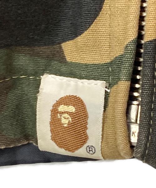 A BATHING APE（アベイシングエイプ）A BATHING APE (アベイシングエイプ) 1ST CAMOリバーシブルナイロンスイングトップ ブラック×カーキ サイズ:Ｍの古着・服飾アイテム