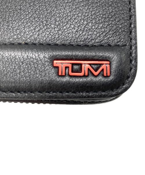 TUMI（トゥミ）TUMI (トゥミ) 長財布 ブラック×レッドの古着・服飾アイテム