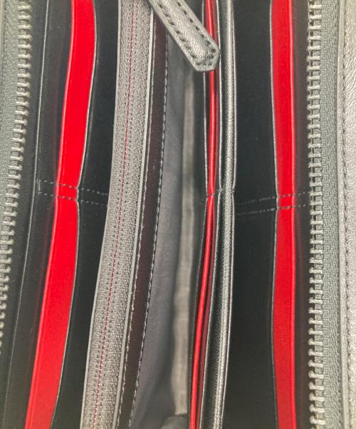 TUMI（トゥミ）TUMI (トゥミ) 長財布 ブラック×レッドの古着・服飾アイテム