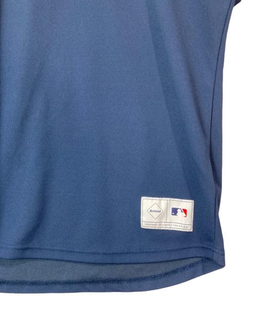 F.C.R.B.（エフシーレアルブリストル）F.C.R.B. (エフシーレアルブリストル) GENUINE MERCHANDISE (ジェニュイン マーチャンダイズ) MLB TOUR S/S PRE MATCH TOP ネイビー サイズ:Lの古着・服飾アイテム