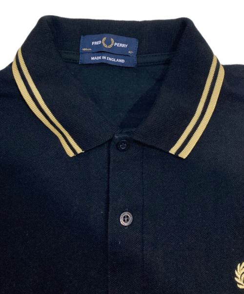 FRED PERRY（フレッドペリー）FRED PERRY (フレッドペリー) ポロシャツ ブラック×ゴールド サイズ:Lの古着・服飾アイテム