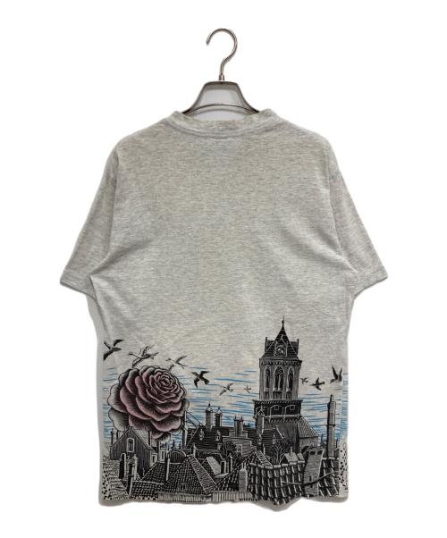 M.C.Escher（マウリッツ・コルネリス・エッシャー）M.C.Escher (マウリッツ・コルネリス・エッシャー) MANY FACE TEE グレー サイズ:L (42-44)の古着・服飾アイテム