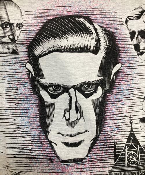 M.C.Escher（マウリッツ・コルネリス・エッシャー）M.C.Escher (マウリッツ・コルネリス・エッシャー) MANY FACE TEE グレー サイズ:L (42-44)の古着・服飾アイテム