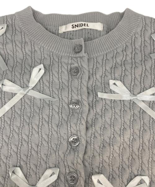 Snidel（スナイデル）Snidel (スナイデル) リボンモチーフカーディガン スカイブルー サイズ:Freeの古着・服飾アイテム