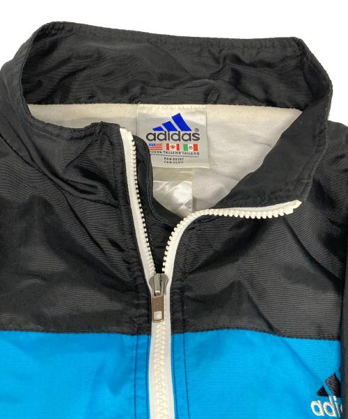 adidas（アディダス）adidas (アディダス) ウインドブレーカージャケット ブラック×ブルー サイズ:XLの古着・服飾アイテム