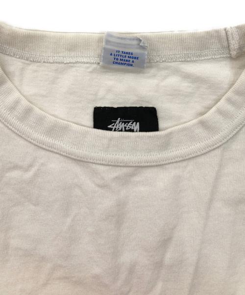 stussy（ステューシー）stussy (ステューシー) Champion (チャンピオン) Astronaut Tee ホワイト サイズ:Mの古着・服飾アイテム