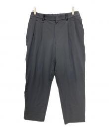 and wander（アンドワンダー）の古着「plain tapered stretch pants/タックナイロンパンツ」｜グレー