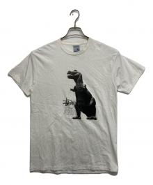 stussy（ステューシー）の古着「ティラノ Tシャツ」｜ホワイト