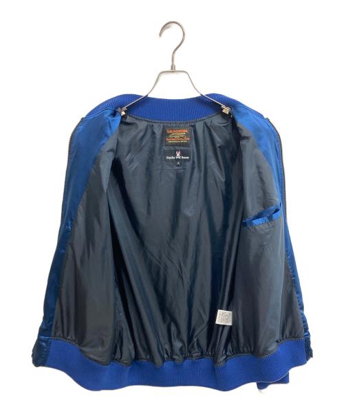 skookum（スクーカム）skookum (スクーカム) Psycho Bunny (サイコ バニー) コラボスカジャン ホワイト×ブルー サイズ:SIZE Mの古着・服飾アイテム