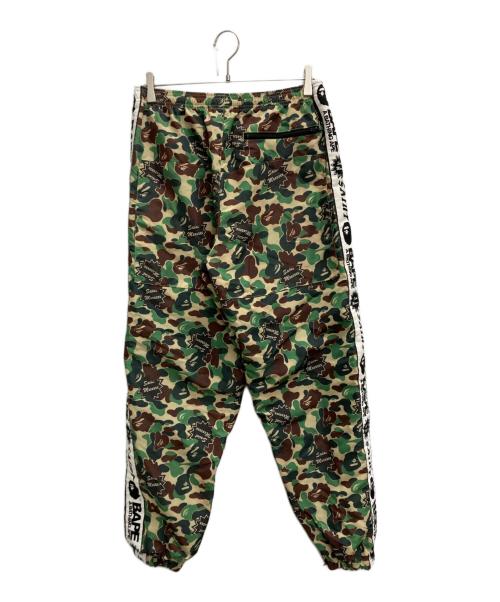 A BATHING APE（ア ベイシング エイプ）A BATHING APE (ア ベイシング エイプ) SAINT MICHAEL (セントマイケル) AP TRACK PNT グリーン サイズ:SIZE Mの古着・服飾アイテム