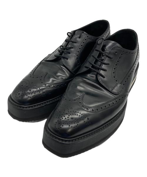 PRADA（プラダ）PRADA (プラダ) メダリオン ウィングチップ レザー ダービーシューズ ブラック サイズ:7の古着・服飾アイテム
