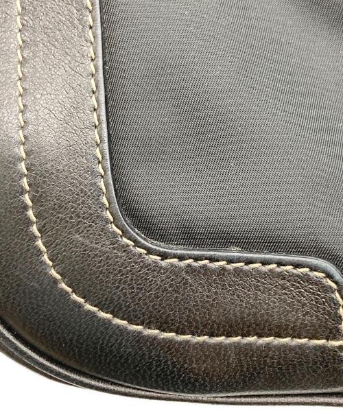 PRADA（プラダ）PRADA (プラダ) レザーナイロンコンビスタッズタッセルハンドバッグ ブラックの古着・服飾アイテム