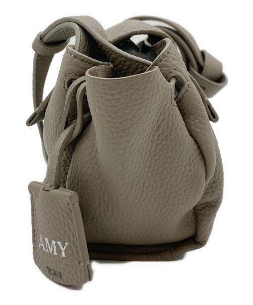 TUMI（トゥミ）TUMI (トゥミ) Kerrie Crossbody/ケリークロスボディバッグ ベージュの古着・服飾アイテム