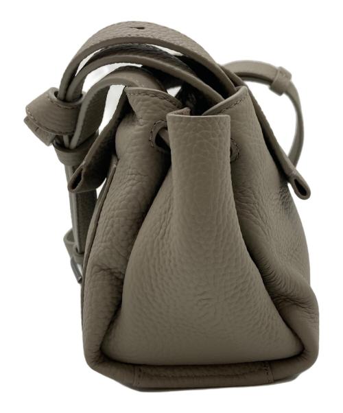 TUMI（トゥミ）TUMI (トゥミ) Kerrie Crossbody/ケリークロスボディバッグ ベージュの古着・服飾アイテム