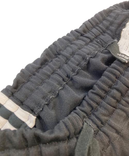 JUNYA WATANABE COMME des GARCONS（(ジュンヤワタナベ コムデギャルソン）JUNYA WATANABE COMME des GARCONS ((ジュンヤワタナベ コムデギャルソン) フロントポケットジャージフレアスカート ブラック サイズ:-の古着・服飾アイテム