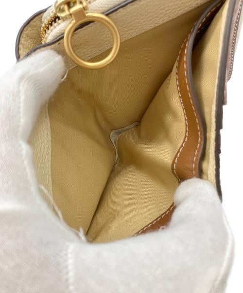 TORY BURCH（トリーバーチ）TORY BURCH (トリーバーチ) ラウンドジップウォレット イエロー×ベージュ サイズ:実寸サイズをご参照下さい。の古着・服飾アイテム