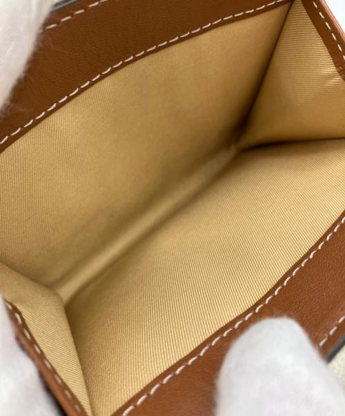 TORY BURCH（トリーバーチ）TORY BURCH (トリーバーチ) ラウンドジップウォレット イエロー×ベージュ サイズ:実寸サイズをご参照下さい。の古着・服飾アイテム