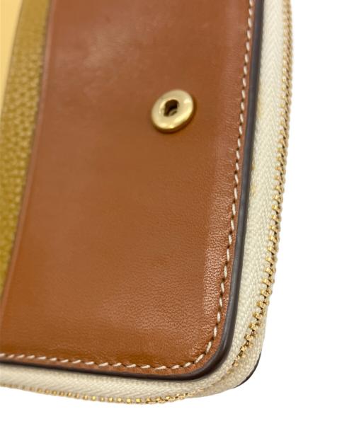 TORY BURCH（トリーバーチ）TORY BURCH (トリーバーチ) ラウンドジップウォレット イエロー×ベージュ サイズ:実寸サイズをご参照下さい。の古着・服飾アイテム